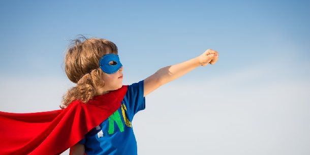 Superhero kid. Girl power concept